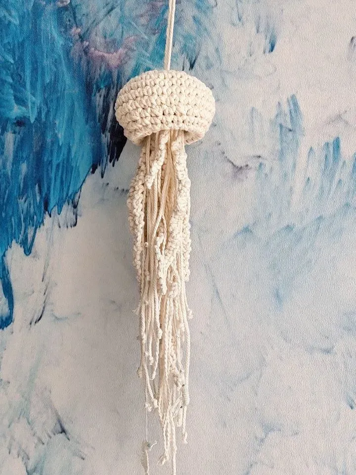 Macramé jellyfish ornament. Wall decor in the form of a jellyfish. Modern macramé. Home decor in coastal style. crocheted jellyfish