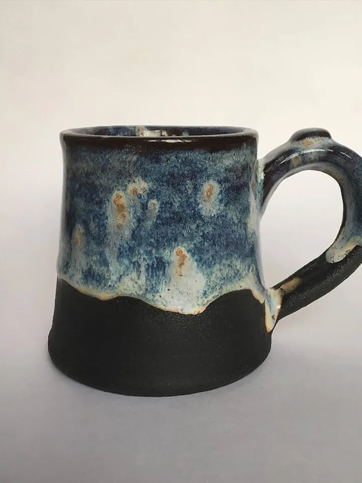 Trinity knot Triquetra in circle blue and black galaxy glazed stoneware mug