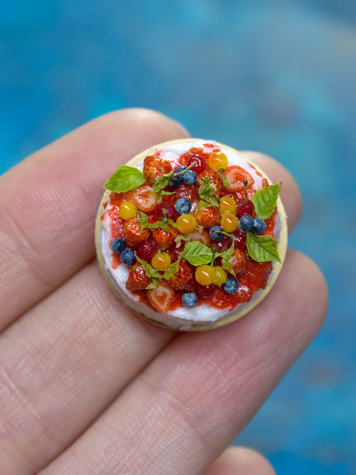 MINIATURE cake with berries on a gold cardboard stand 3