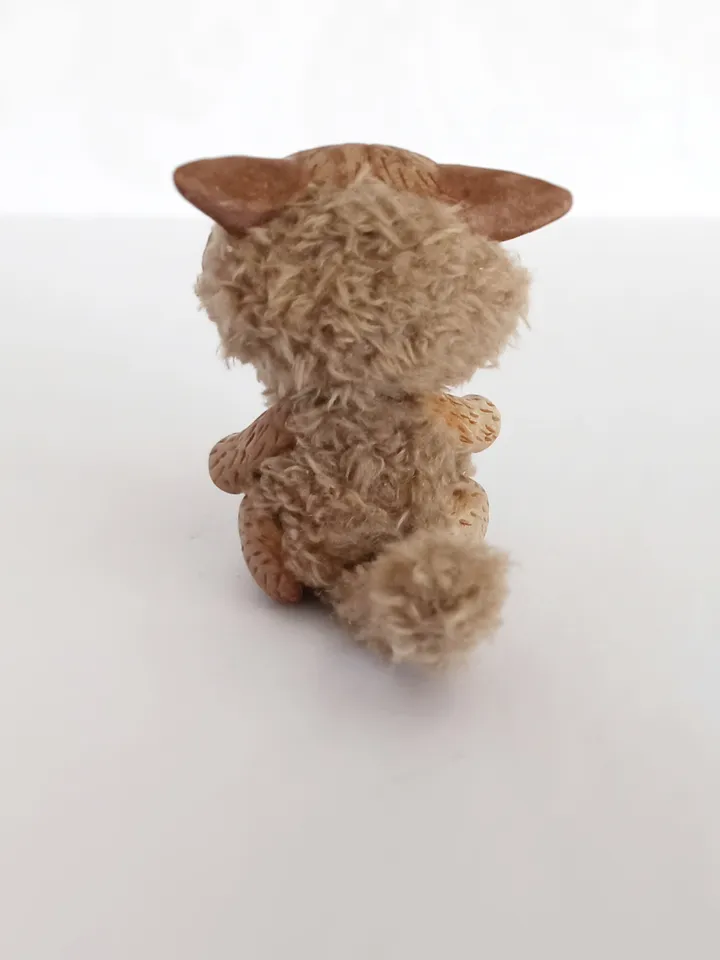 Discouraged cat doll