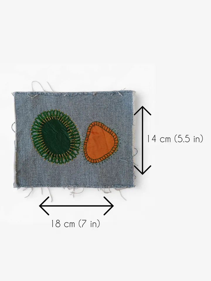 Upcycled denim boro patch – visible mending.