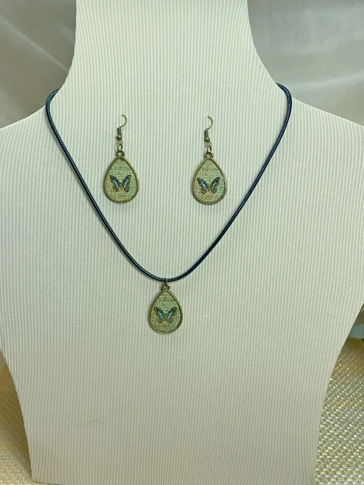 Handmade jewelry set. Shiny butterflies in a bronze frame. designer jewelry.