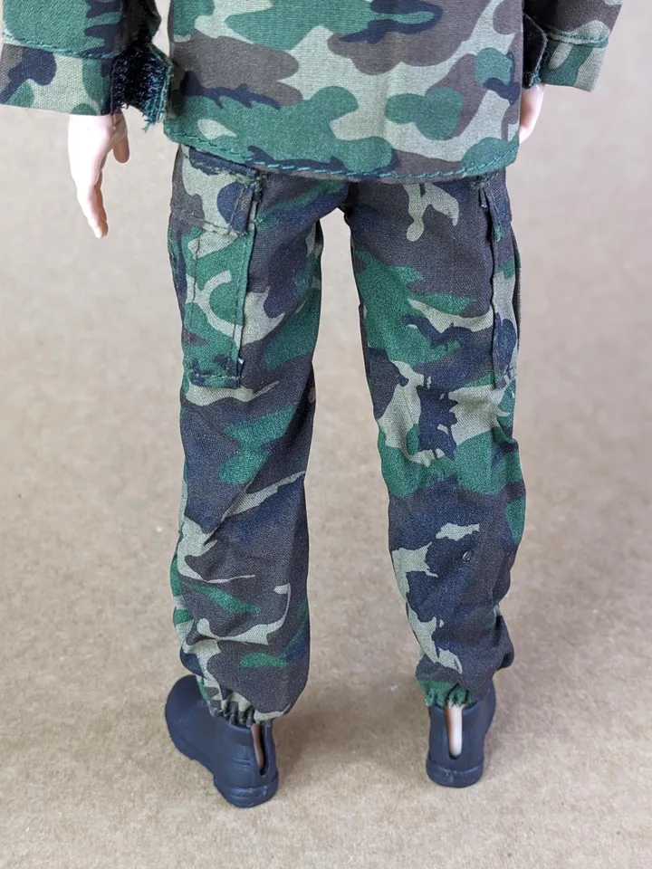 Military-style camo jacket, pants, and backpack for 12-inch fashion male dolls