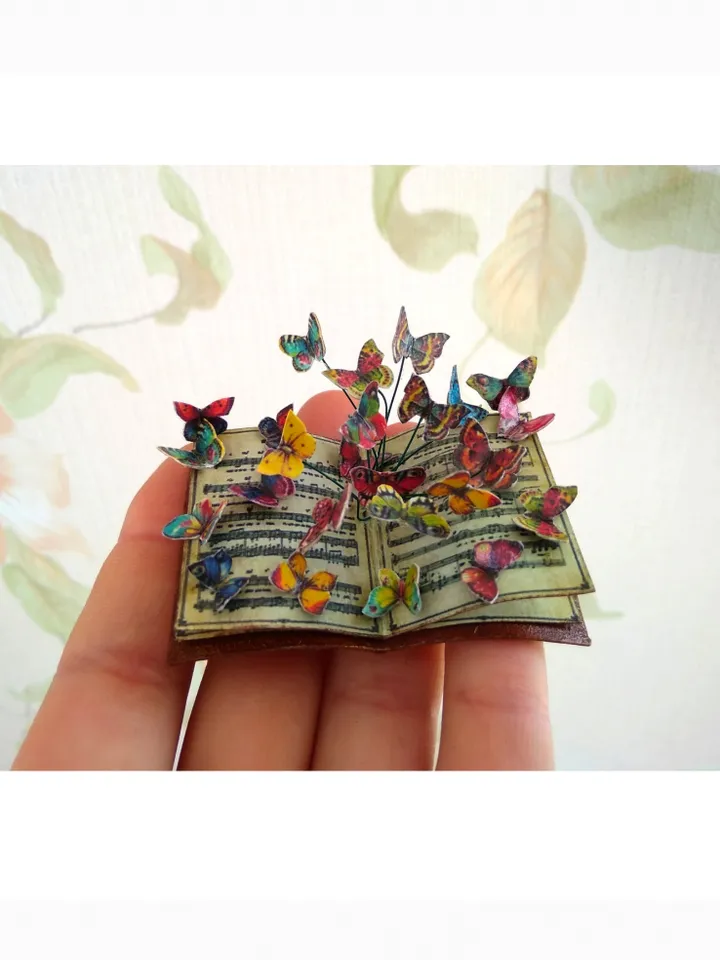 Miniature book with flying butterflies.1:12 scale.