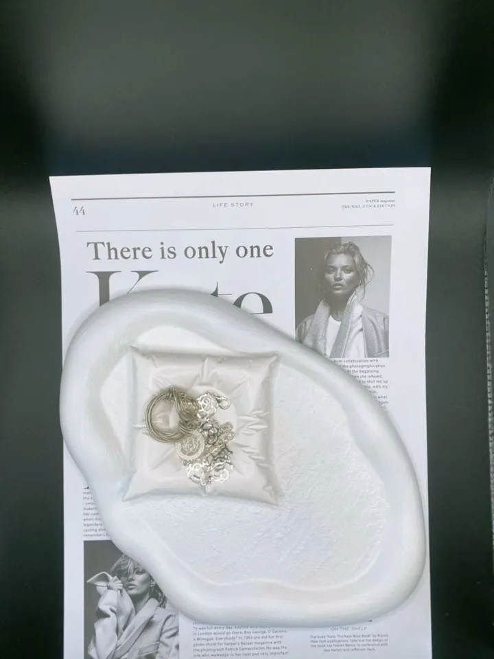 Stand for candlestick and jewelry made of plaster in the shape of a pillow
