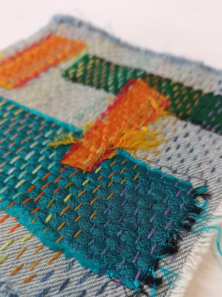 Upcycled denim boro patch – visible mending.