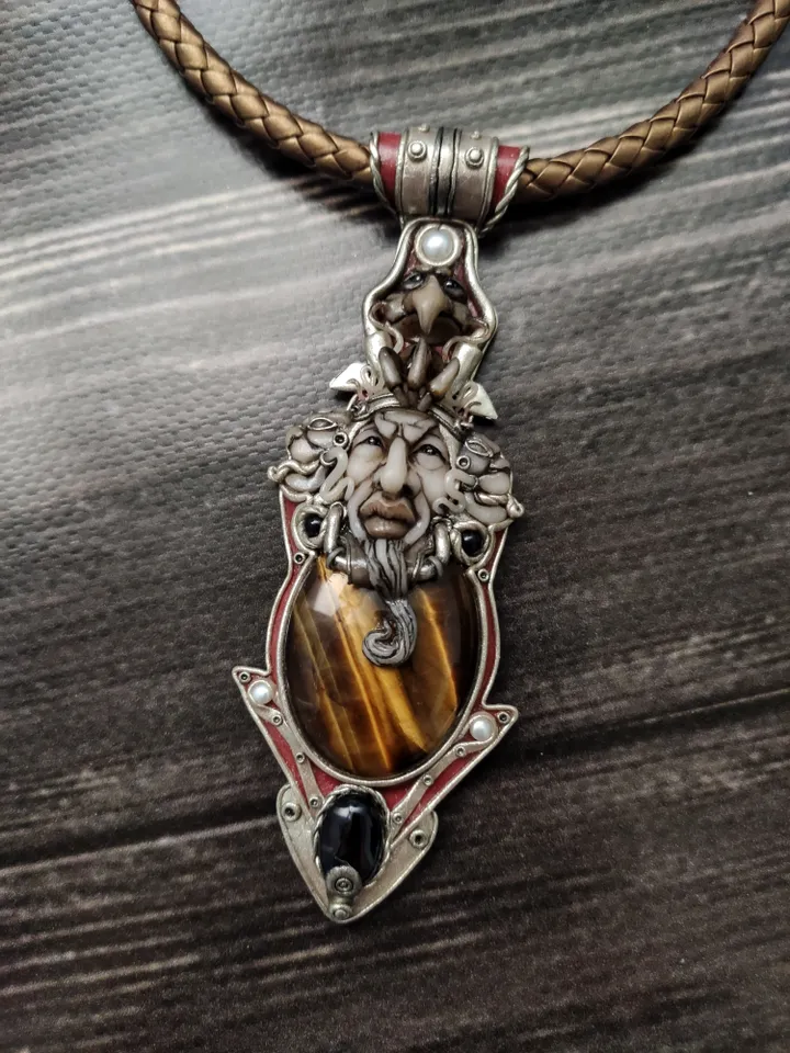 Necklace Shaman on a leather cord. Central cabochon natural tiger eye stone.
