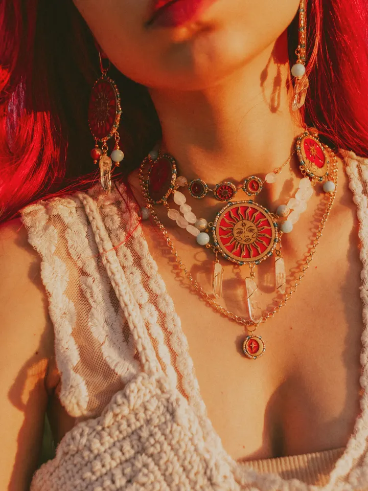 Small choker necklace When The Sun Meets The Moon with quartz crystals. Gold stackable jewelry with celestial design in sunset red and orange color with beading. Maylina Soul