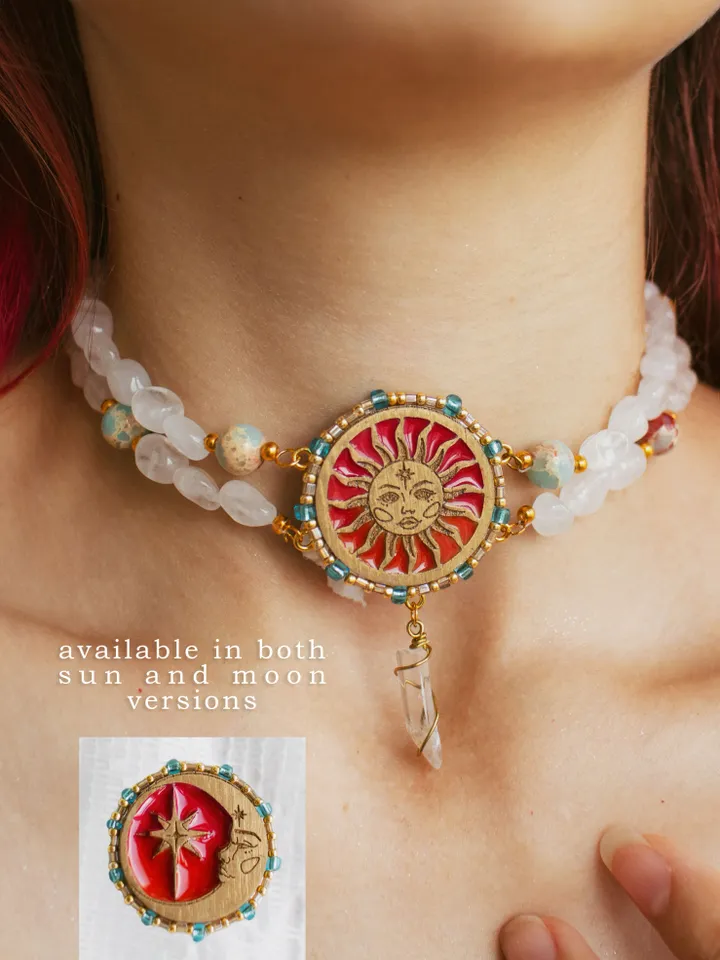 Choker necklace When The Sun Meets The Moon with blue jasper and clear quartz crystals. Gold jewelry with celestial design in sunset red and orange color with beading. Maylina Soul