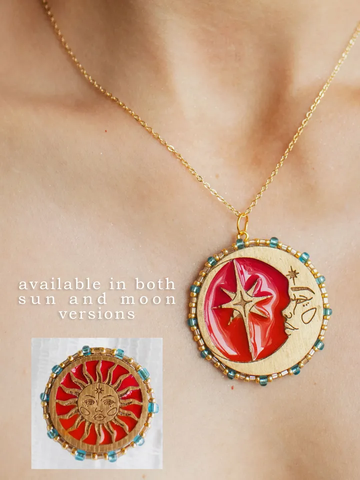 Pendant necklace When The Sun Meets The Moon. Gold stackable jewelry with celestial design in sunset red and orange color with beading. Maylina Soul