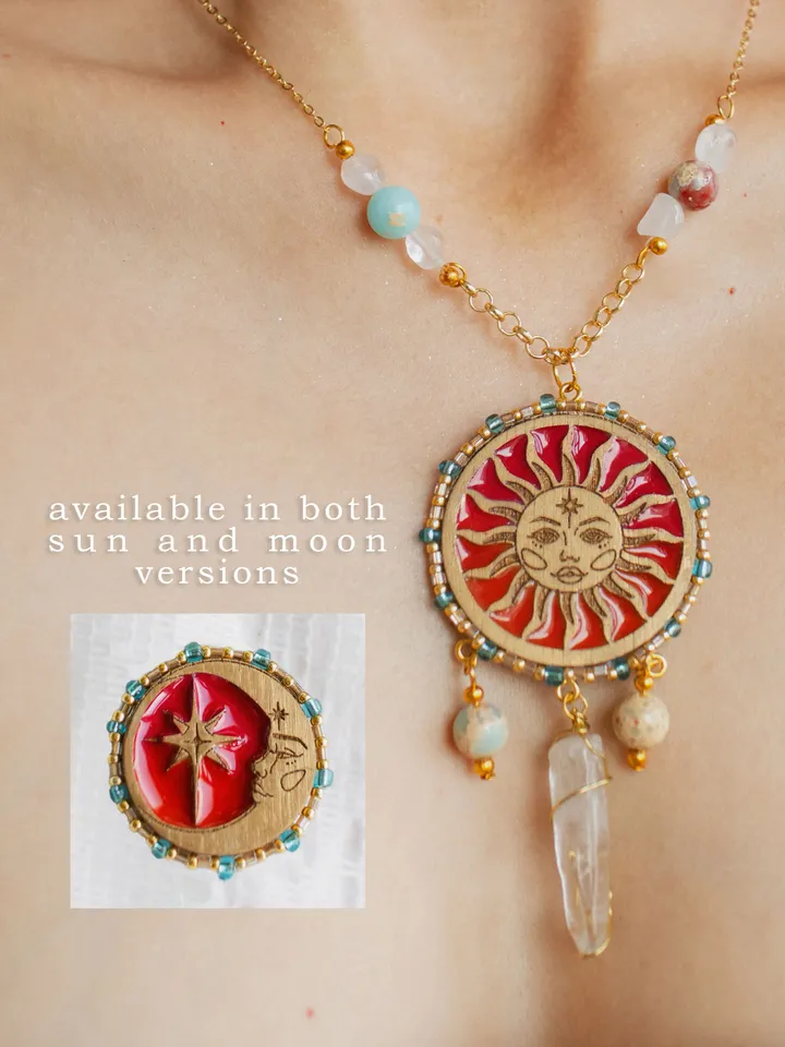 Pendant necklace When The Sun Meets The Moon with blue jasper and clear quartz crystals. Gold jewelry with celestial design in sunset red and orange color with beading. Maylina Soul