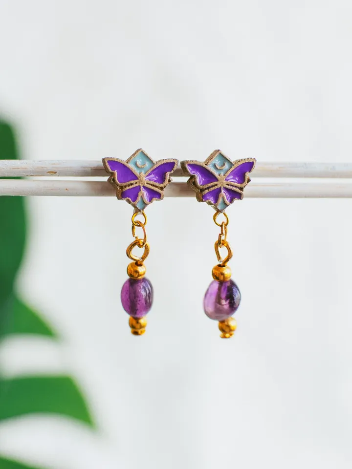 Stud earrings Moonlight Serenity with amethyst crystals. Gold jewelry with butterflies and moons in light blue and deep purple color. Maylina Soul
