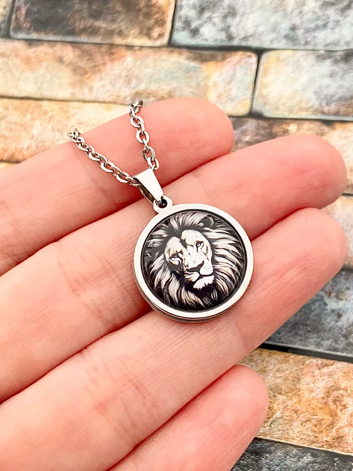 Lion, steel pendant with glass