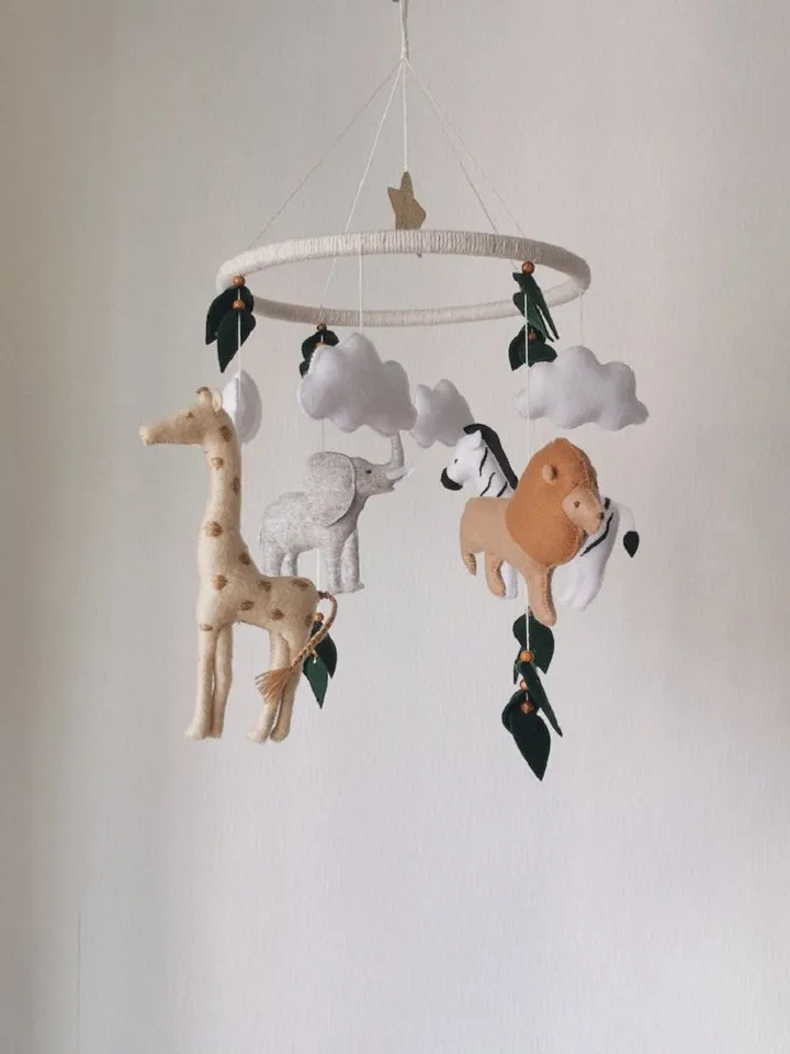Safari mobile baby nursery decor crib