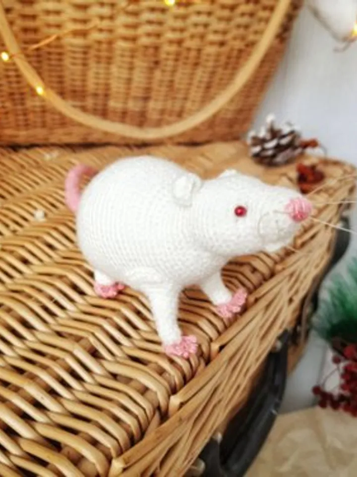 White mouse toy. Soft toy life-size white rat with red eyes.