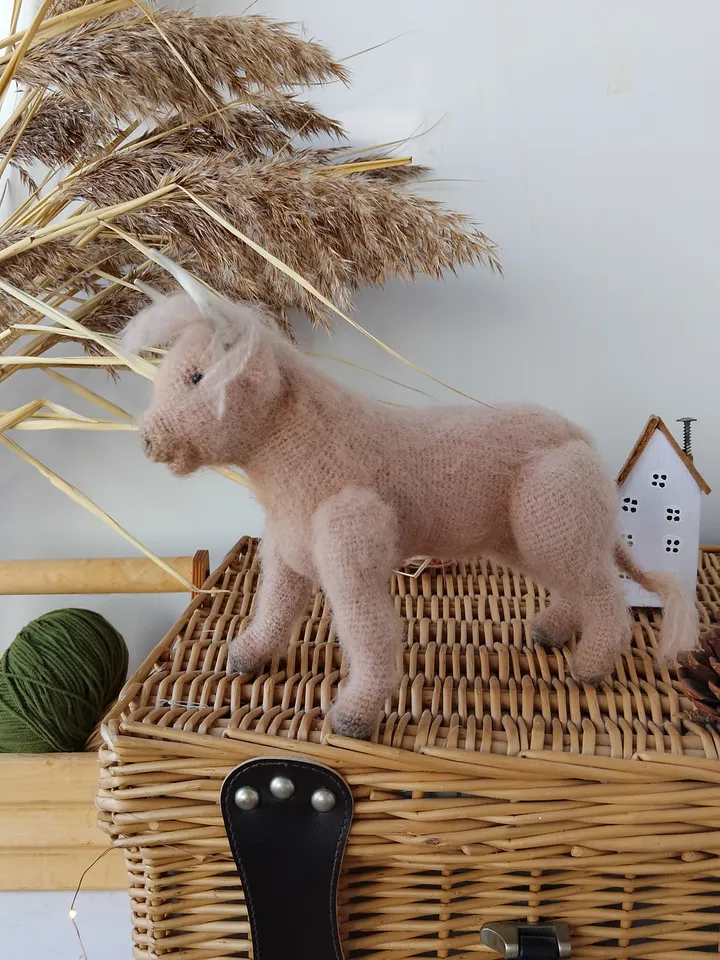 Naturalistic handcrafted bull figure with decorative elements. Stuffed cow Collectible model specimen bull toy