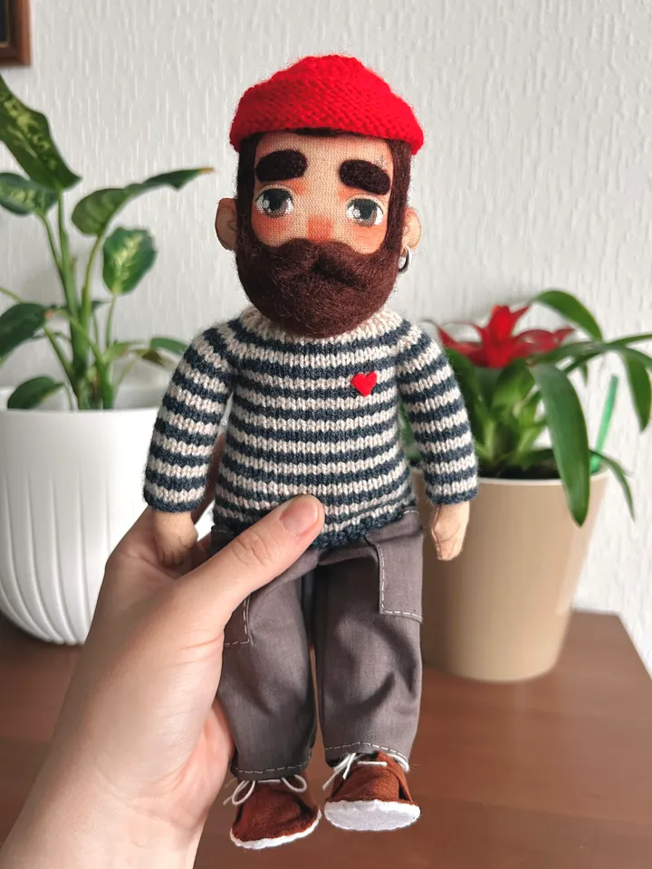 Textile doll sailor with tattoo in a dark blue striped sweater