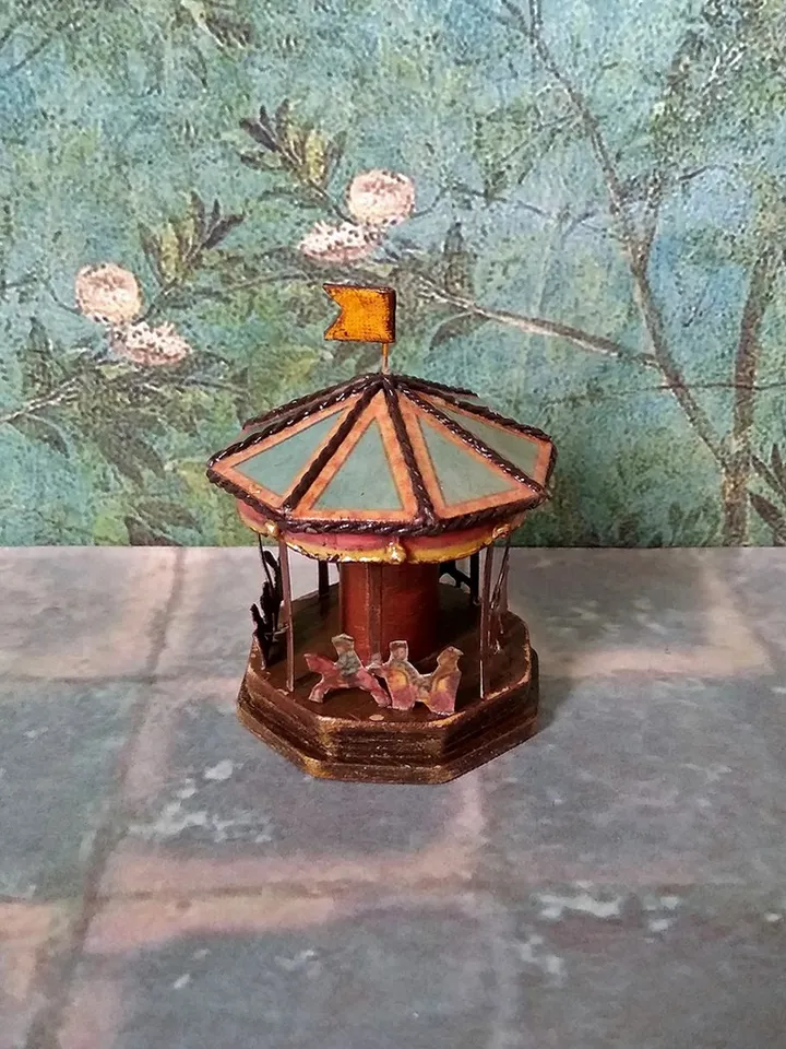 Miniature carousel. Dollhouse miniature.1:12 scale.
