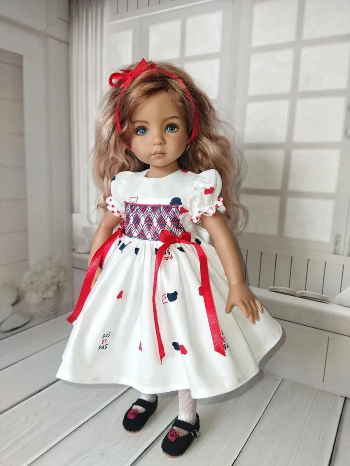 Smocked dress with hand embroidery.