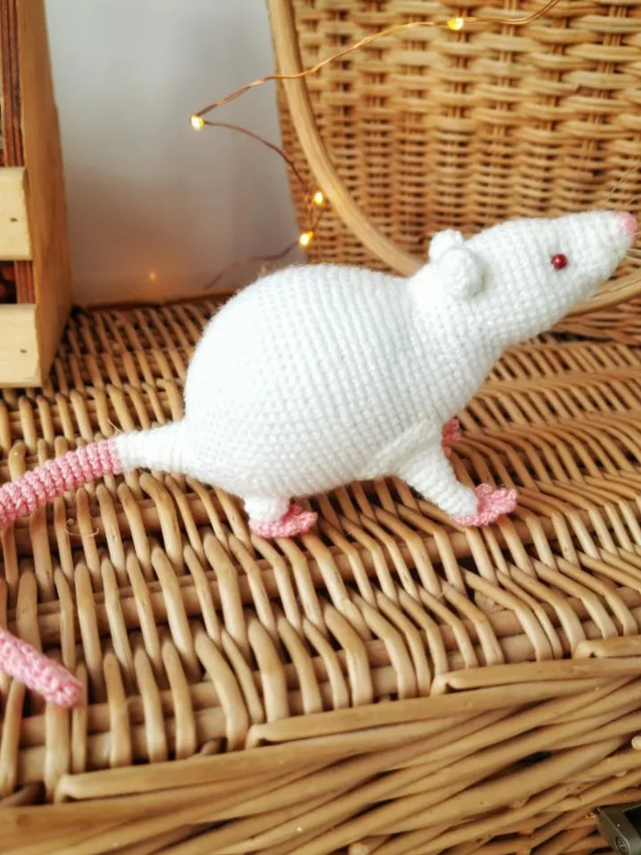 White mouse toy. Soft toy life-size white rat with red eyes.