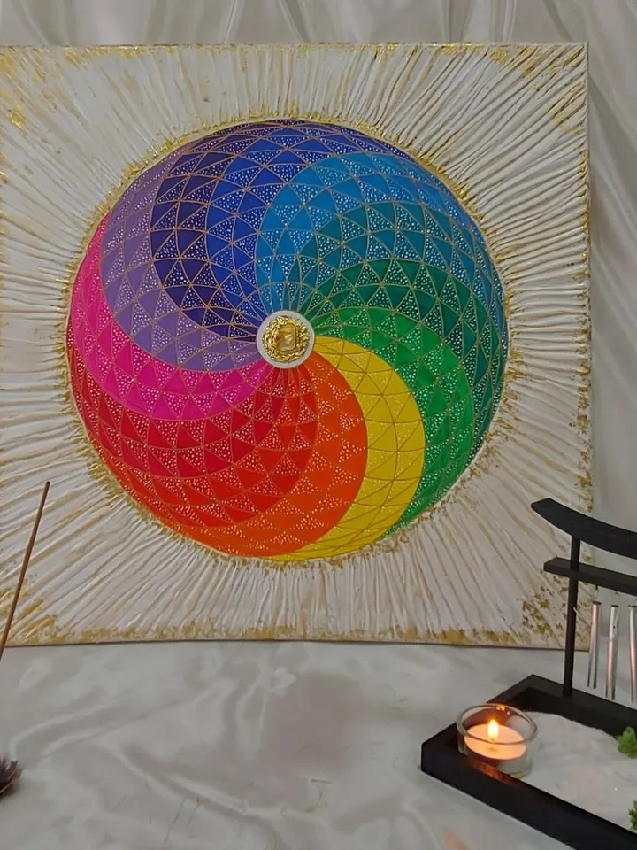 The rainbow sphere, with sacred geometry and white rays surrounding it