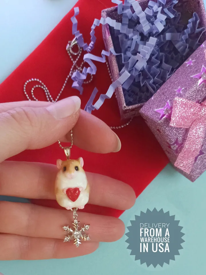 A small handmade hamster necklace in red and white color