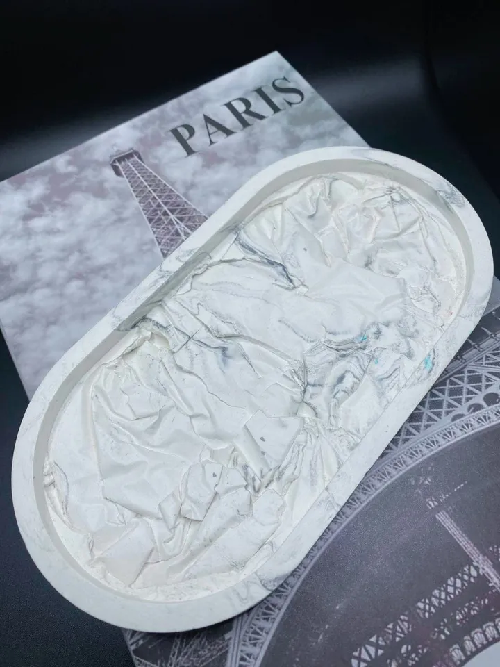 Decorative oval tray with a design solution made of plaster