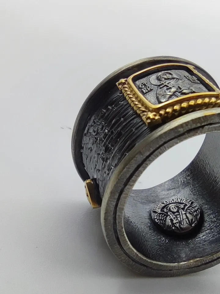 Gorgeous ring with faces of saints