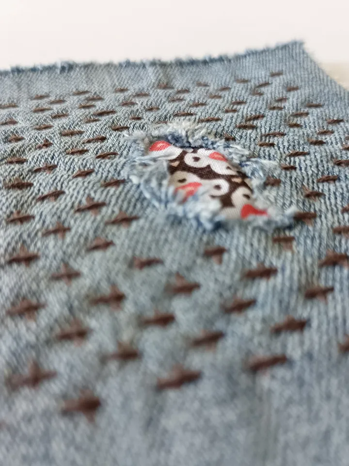 Upcycled denim boro patch. Sashiko stitching.