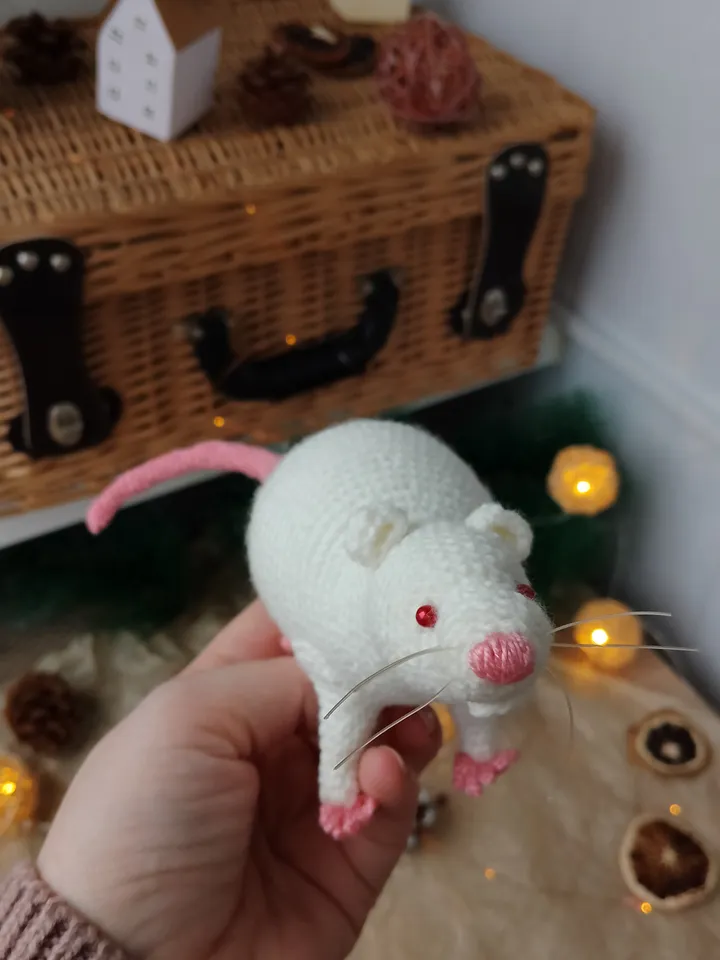 White mouse toy. Soft toy life-size white rat with red eyes.