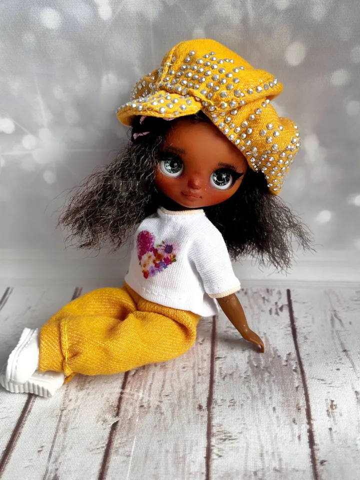 Petite Blythe with dark skin. Adorable miniature doll on an articulated body.