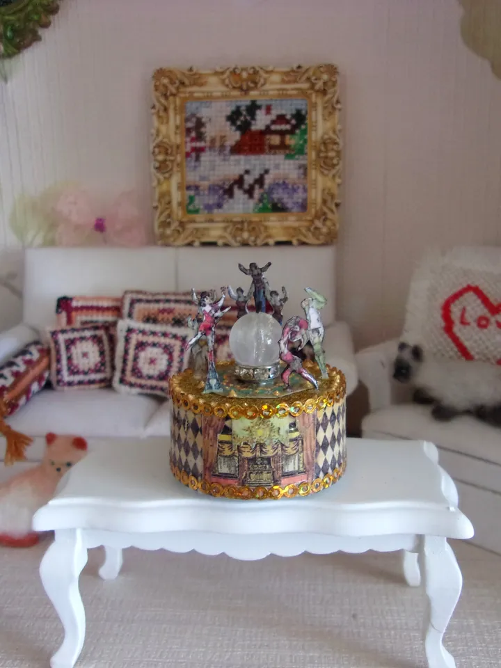 Mini circus with lights. acrobats on stage. LED candle