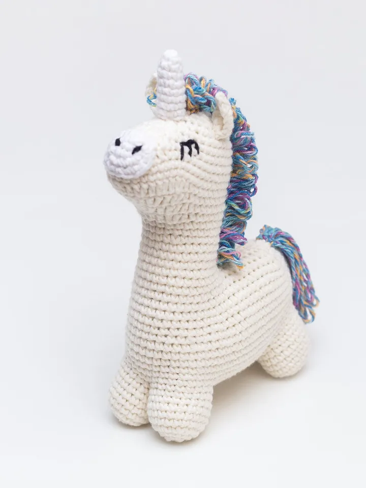 Pregnancy gift basket with crochet unicorn booties sweet toy and rainbow striped multicolored blanket Bright newborn new mom parents gift