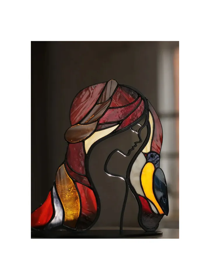 Girl with a Bird. Tiffany Stained Glass, Stained Glass Featuring a Girl and a Bird, Stained Glass with a Girl and Bird on a Stand, Stained Glass "Girl and Bird" on Base, Stained Glass Featuring a Girl and Bird