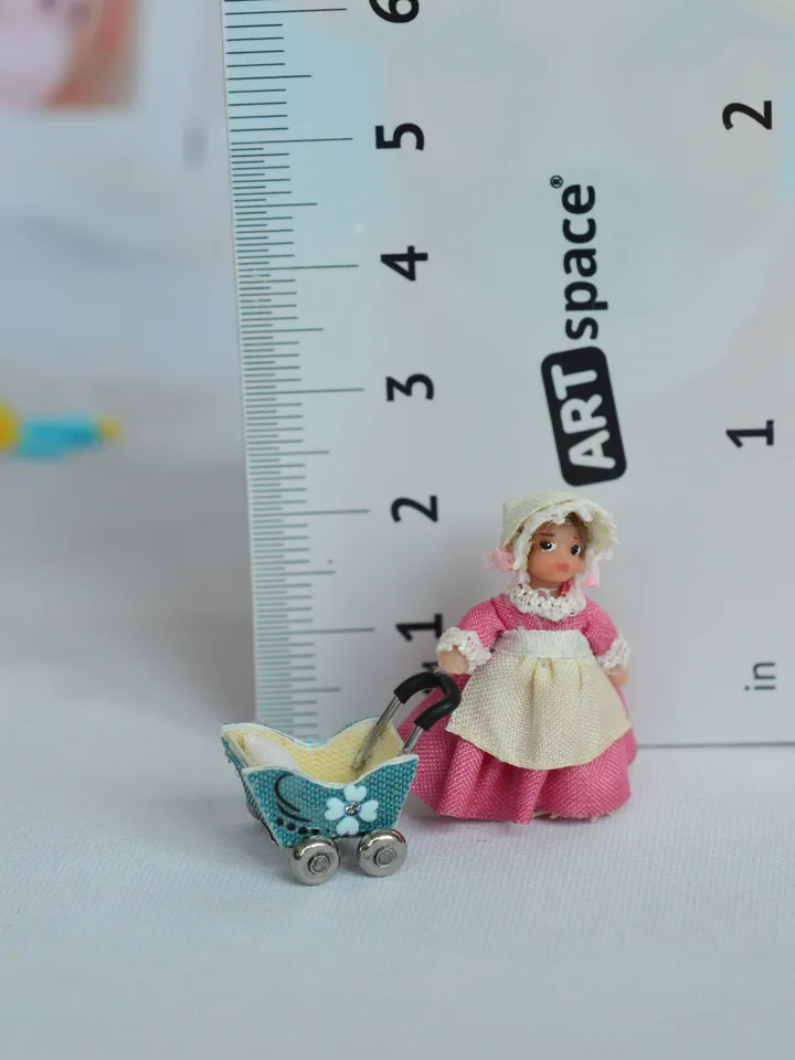 Miniature doll stroller. 1:48 scale. Dollhouse toy. Baby stroller.