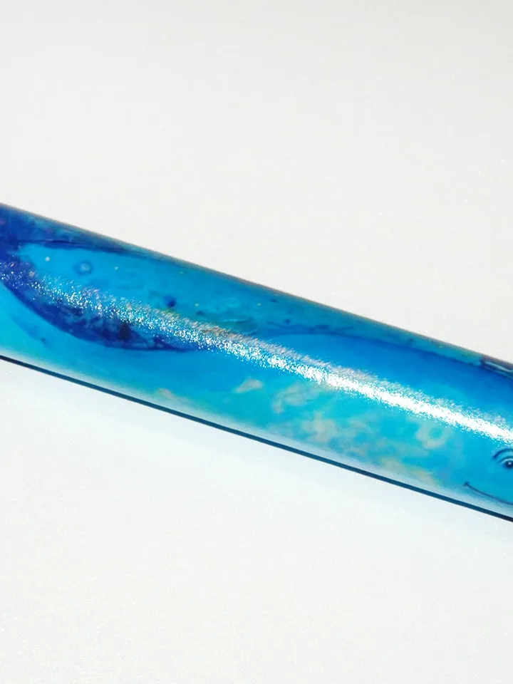 Glass kaleidoscope with Blue whale painting on label. Unusual gift for men who have everything