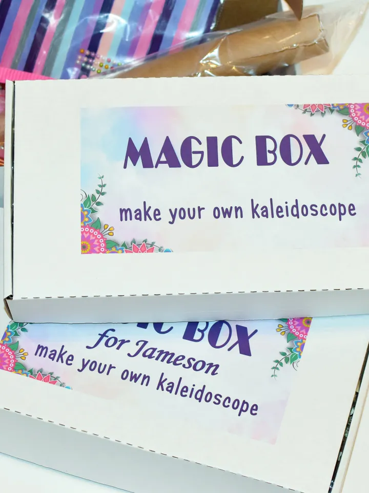 Mystery box with DIY kaleidoscope kit. Educational activity and toddler learning toy. Christmas eve box with stim toy and adult craft kit.
