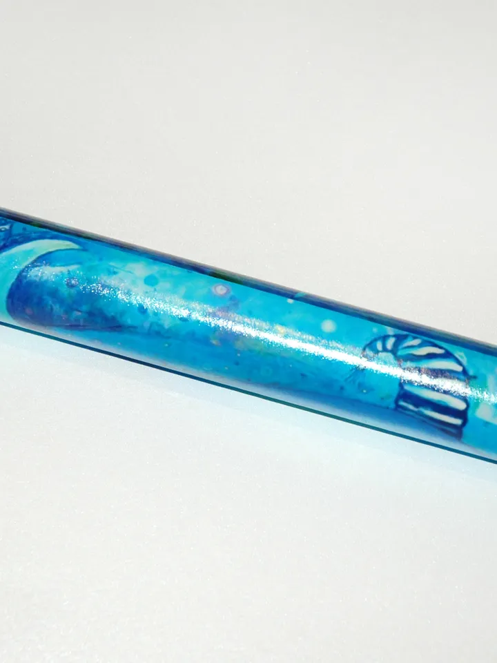 Glass kaleidoscope with Blue whale painting on label. Unusual gift for men who have everything