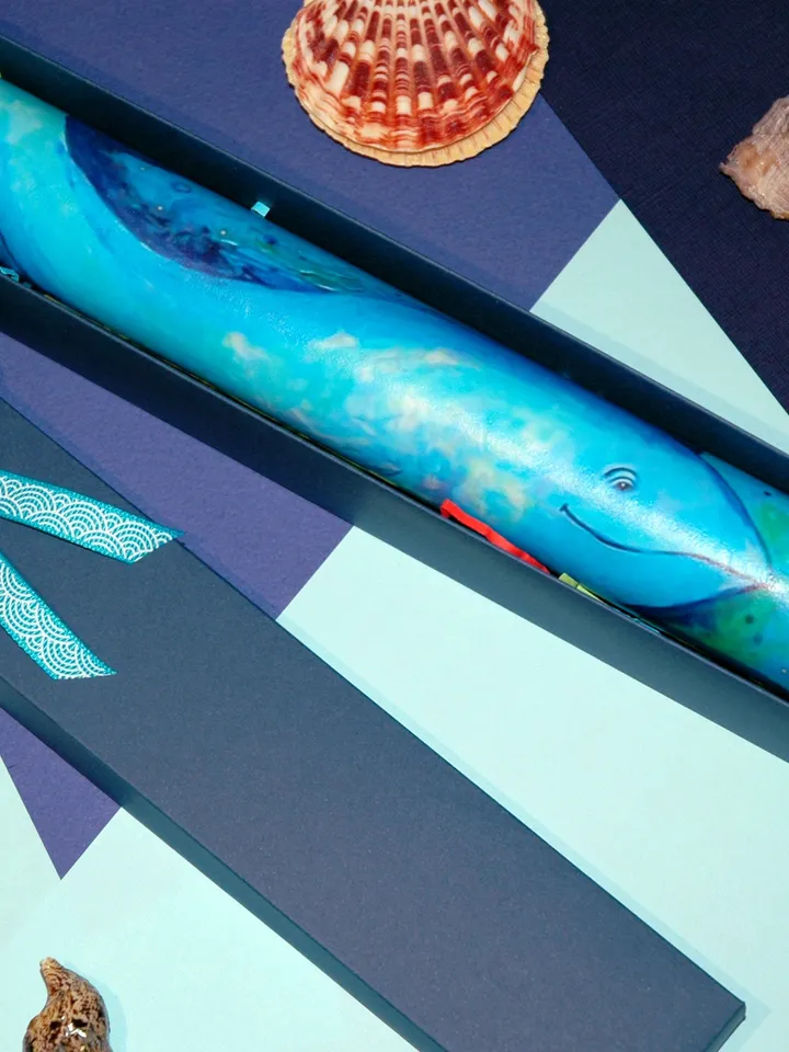 Glass kaleidoscope with Blue whale painting on label. Unusual gift for men who have everything
