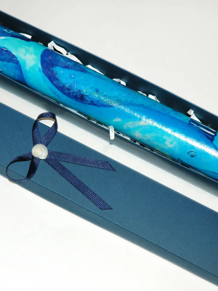 Glass kaleidoscope with Blue whale painting on label. Unusual gift for men who have everything