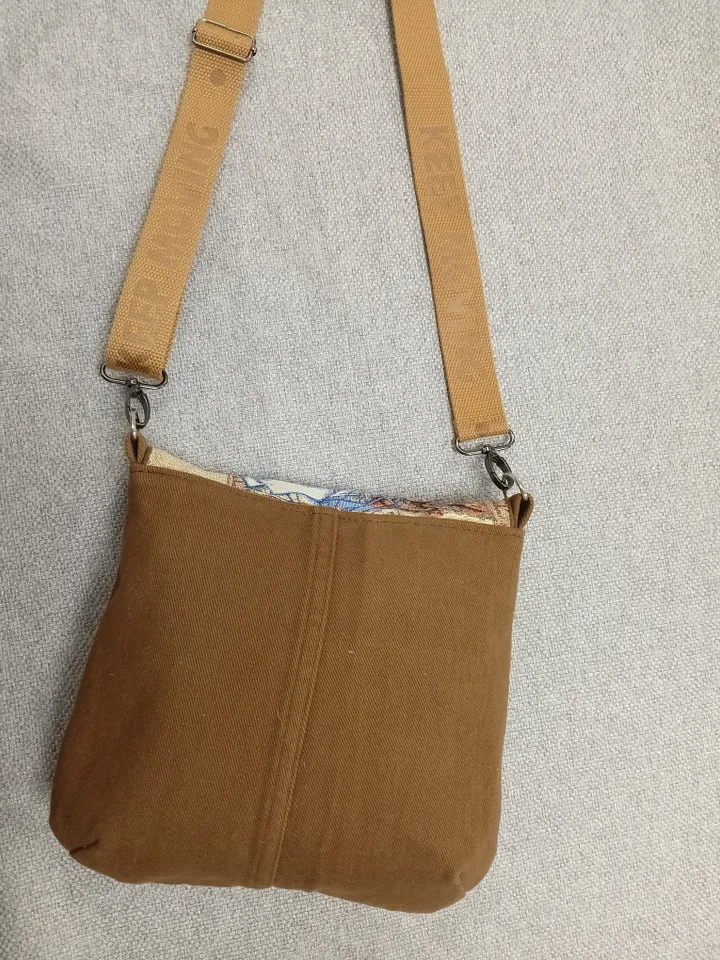 Brown crossbody /shoulder denim bag, a women's messenger bag with a tapestry flap with a marine theme pattern and denim shoulder bag with 4 pockets inside and an adjustable strap.