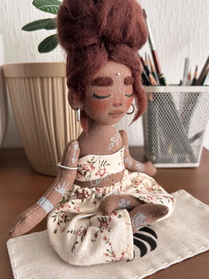 Textile doll yoga girl with dark hair and tattoo