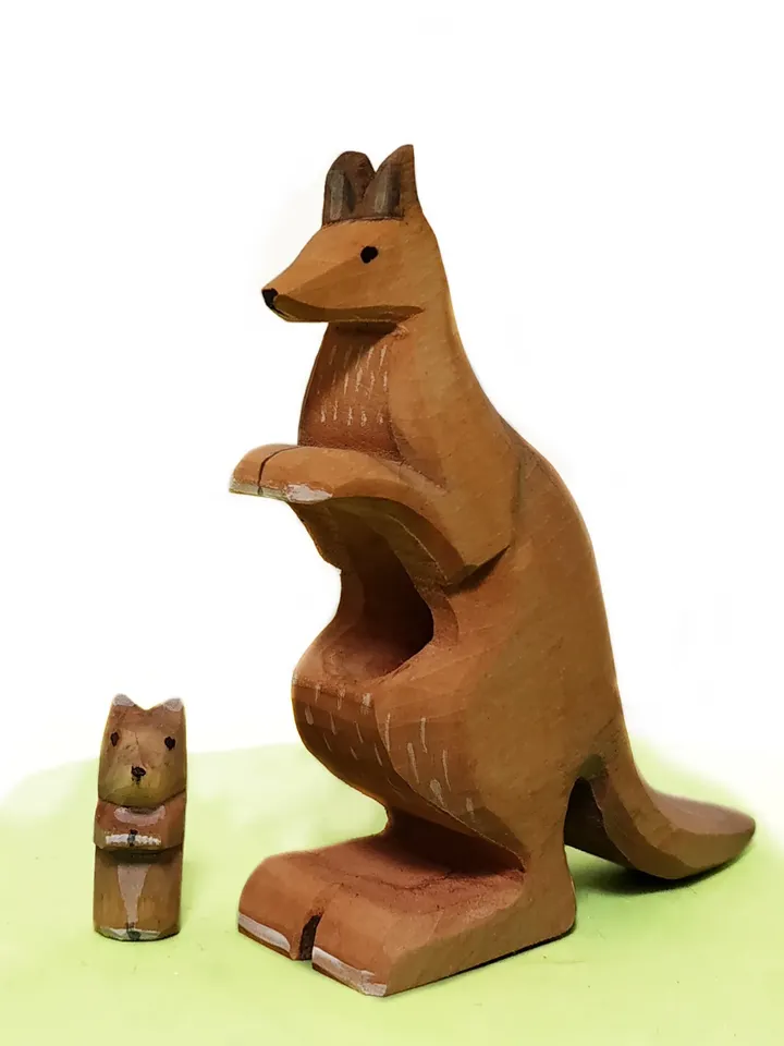 Wooden toy kangaroo with a baby.