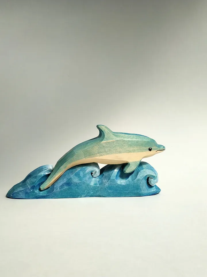 Dolphin on the waves, wooden puzzle toy.