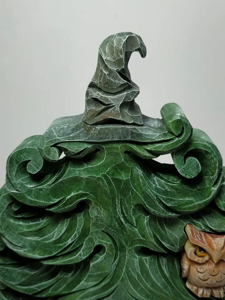 Christmas tree puzzle in a hat from Hogwarts with an owl.