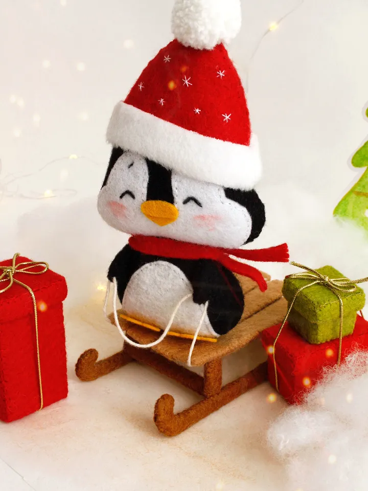 Felt penguin on the sleigh with Christmas presents hand sewing PDF tutorial with patterns, DIY Christmas tree ornament. Soft toy pattern