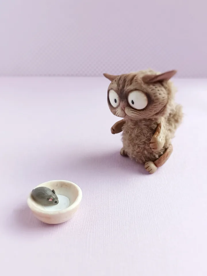 Discouraged cat doll