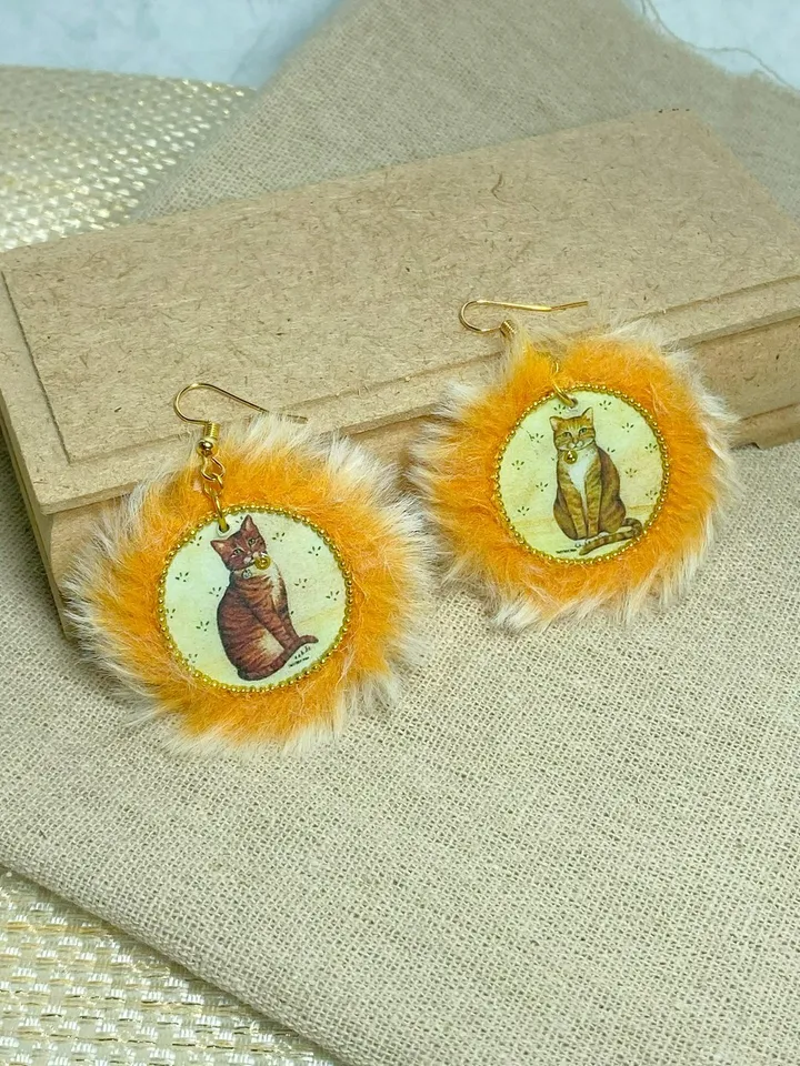 Cute handmade earrings. Image of cats, fur trim.