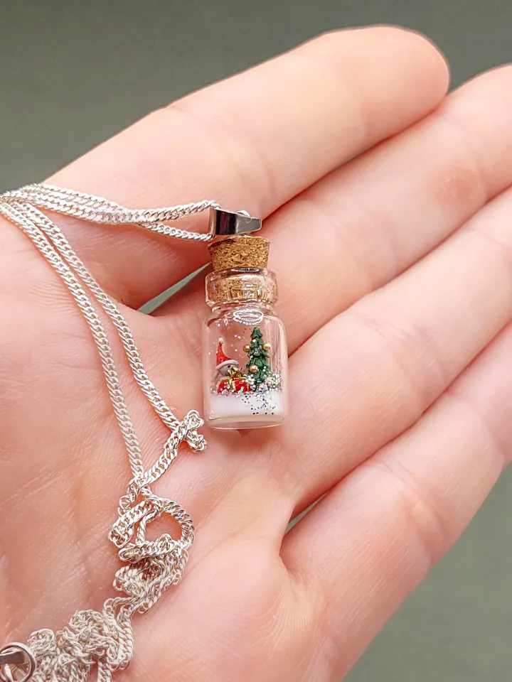 Pendant jewelry Christmas composition in a jar on a silver chain