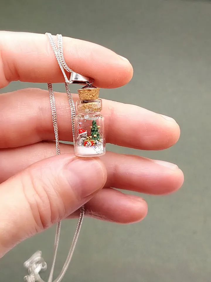 Pendant jewelry Christmas composition in a jar on a silver chain